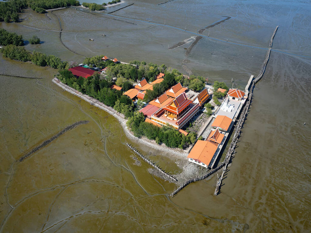 Wat Khun Samut Chin in Samut Prakan, Thailand. There was a village around the temple, but when mangrove forests where cleared for shrimp farms, erosion removed the village by 3-5 metres per year. - Photo, Image