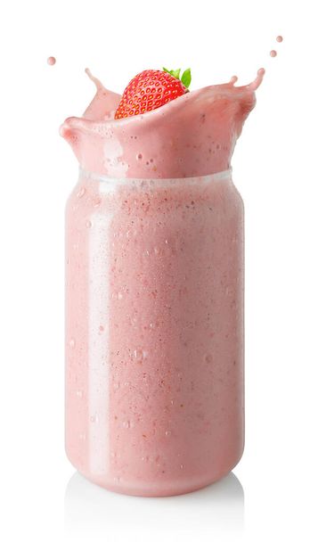 strawberry smoothie or milkshake with splash in glass jar isolated on white background - Fotografie, Obrázek