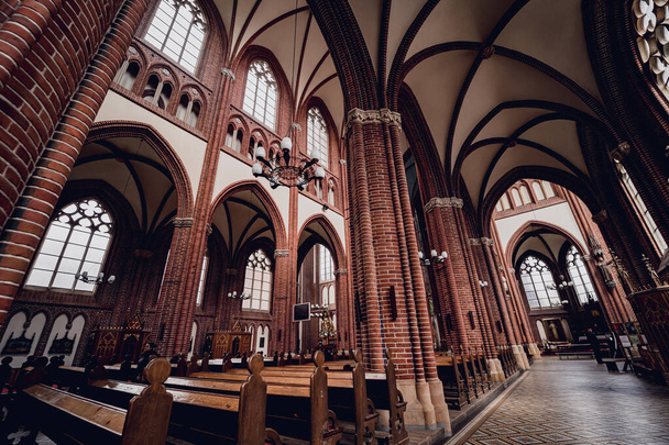 Interior of the main nave of old european catholic church. - Фото, изображение
