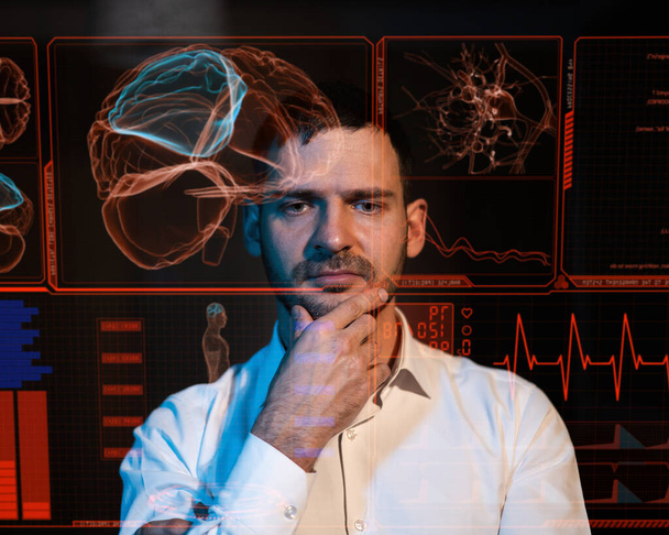 A bearded man sits in the dark in front of a virtual menu. Human brain research - Foto, immagini