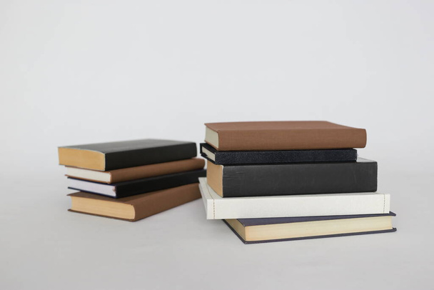 stack of books on white table - Foto, imagen