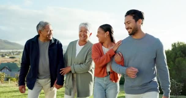 Nature, senior parents and couple walking for bonding, quality time and happiness outdoors. Happy family, love and elderly mom and dad with daughter or son in law for holiday, vacation and relax. - Footage, Video