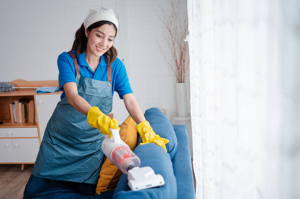 Housework or house keeping service female cleaning dust in home, cleaning agency small business. professional equipment cleaning old home. - Foto, immagini