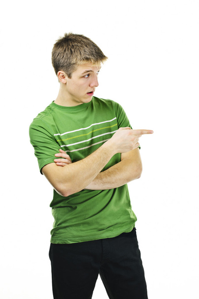 Young man pointing to the side - Фото, зображення