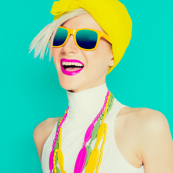 Happy summer girl in trendy bright accessories on blue backgroun - Foto, afbeelding