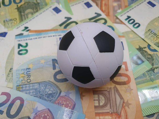 Euro coins and banknotes money currency of European Union and football ball useful as sport and money concept - Zdjęcie, obraz