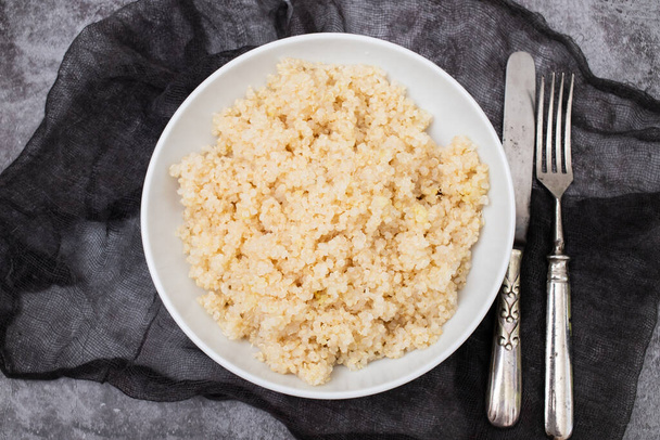 Tasty fresh boiled quinoa in white big bowl - Photo, Image