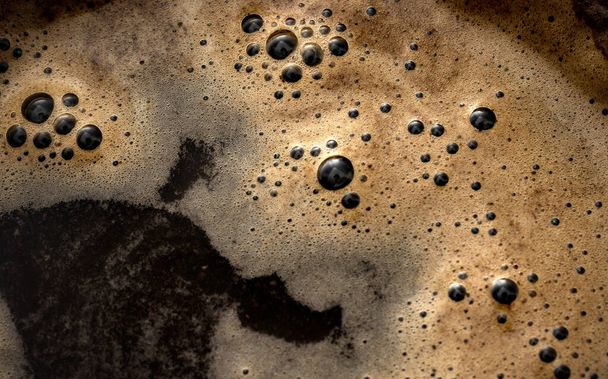 Full Frame Close-Up Overhead Macro Shot of Aromatic Hot Black Coffee Drink Concept for Morning Energy Boost, Freshly Brewed Java Beverage, and Invigorating Caffeine Break - Zdjęcie, obraz