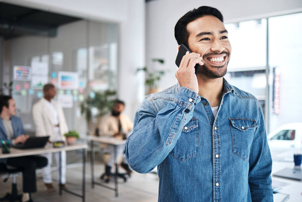Happy man, deal or business developer on a phone call talking, networking or speaking of ideas in office. Smile, mobile communication or founder in conversation for a negotiation offer or planning. - Photo, image