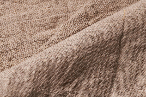 Linen in different textures and colors. Natural fabrics from organic flax and cotton, homespun textile handmade. Burlap and canvas for eco, rustic, boho, hygge decor closeup background - Photo, Image