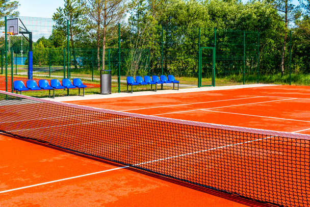 Public sports grounds for tennis and basketball. Landscaped sport grounds. - Foto, Imagem