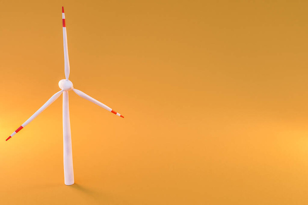colorfull background; miniature windmill sustainablity renewable energy concept; 3d illustration - Фото, изображение