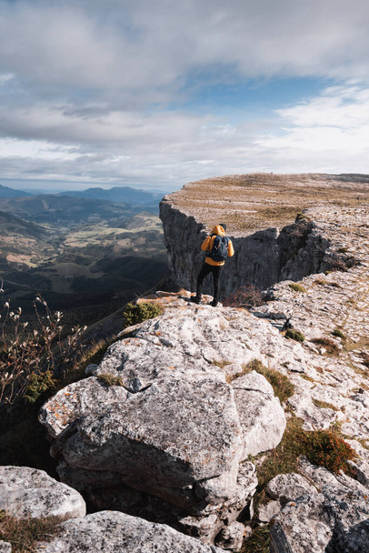 mountaineer enjoying the spectacular views of the ayala valley from the mountain range of Gorobel or Sierra Salbada - Φωτογραφία, εικόνα