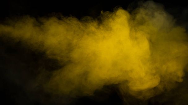 Yellow steam on a black background. Copy space. - Foto, Imagen