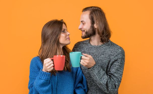 happy couple in love drink hot wine wear knitted clothes in winter, breakfast. - Photo, Image