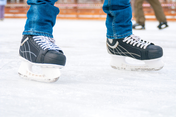 Feet in ice skating rink - Foto, imagen