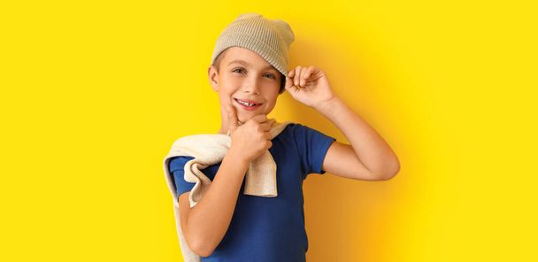 Cute fashionable boy on yellow background - Photo, Image