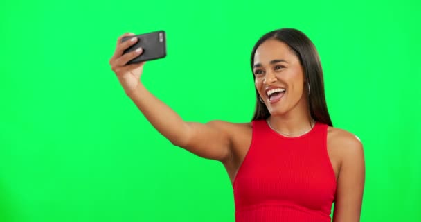Woman, green screen and selfie with kiss, smile and mockup space with post on social network. Influencer girl, model or young student with photography, peace sign and happy for promo with mobile app. - Footage, Video
