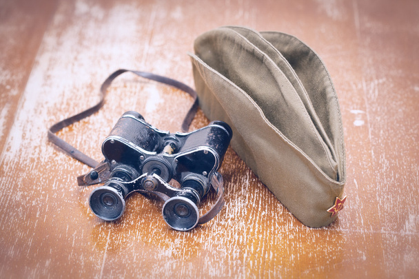 Binoculars and a field cap with a red star - Photo, Image