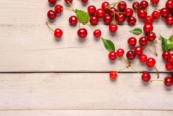 Many red sweet cherries on grey wooden background - Zdjęcie, obraz
