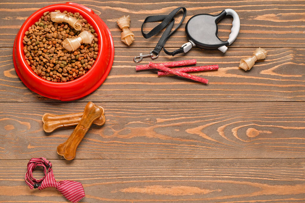 Set of dog food with accessories on wooden background - Foto, immagini