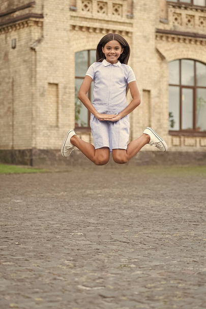 childhood happiness of happy teen girl outdoor. childhood happiness of teen girl jumping outside. photo of childhood happiness of teen girl. childhood happiness of teen girl. - Photo, image