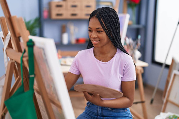 African american woman artist smiling confident drawing at art studio - Photo, Image