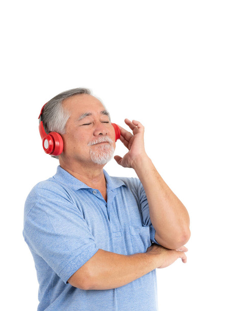 Lifestyle senior man feel happy enjoy listening to music with earphones headphones isolated on white background - Fotó, kép