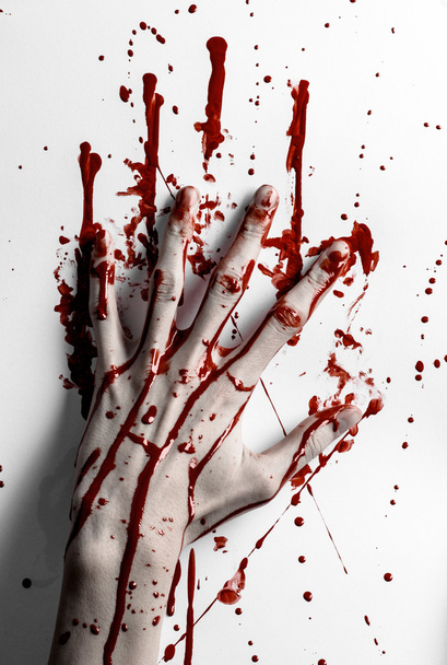 Bloody halloween theme: bloody hand print on a white leaves bloody wall - Foto, imagen