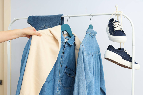 Wardrobe rack with different clothes, concept of different clothes - Fotó, kép