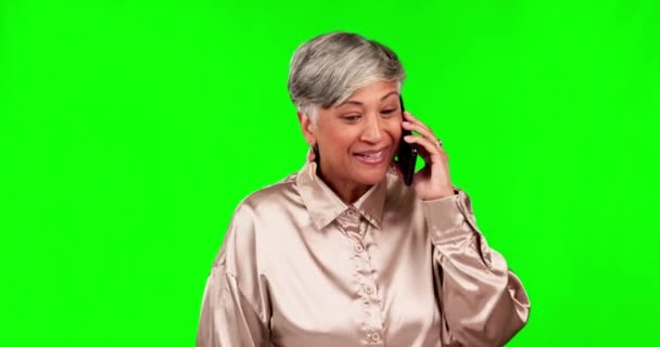 Phone call, conversation and senior woman on green screen for chat. talking and discussion with news. Communication, networking and excited female person on smartphone for contact in chromakey studio. - Footage, Video