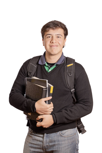 Portrait of a college student with books and backpack isolated on white background. - Photo, image