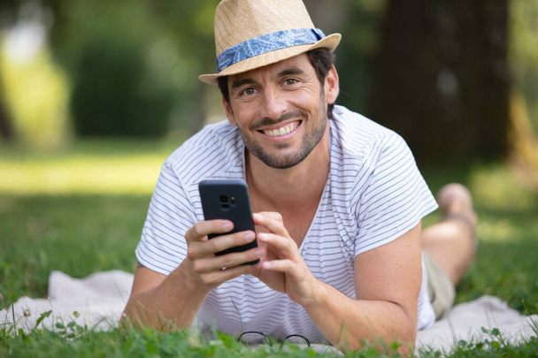 a handsome man on the grass - Фото, зображення