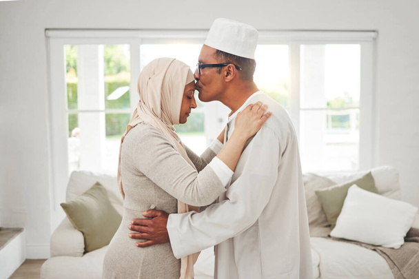 Home, Muslim or senior couple kiss, slow dance and bond for love, trust and care in retirement, support or marriage. Romance, Islamic or Arab man, woman and elderly people together for quality time. - Photo, image