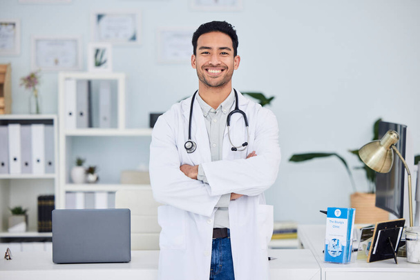 Happy asian man, doctor and arms crossed in confidence of healthcare consultant at the office. Portrait of confident and male person or medical professional ready for health consultation or advice. - Foto, Bild