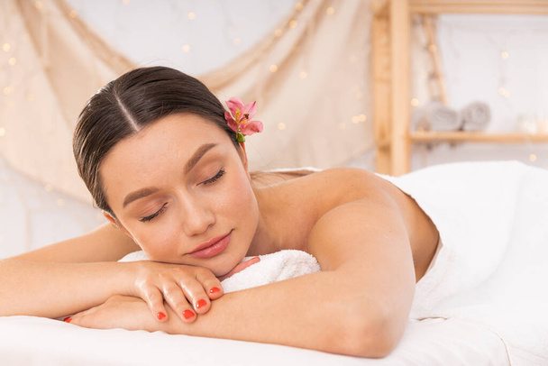 Concept of spa, relax and self care with beautiful young woman - 写真・画像