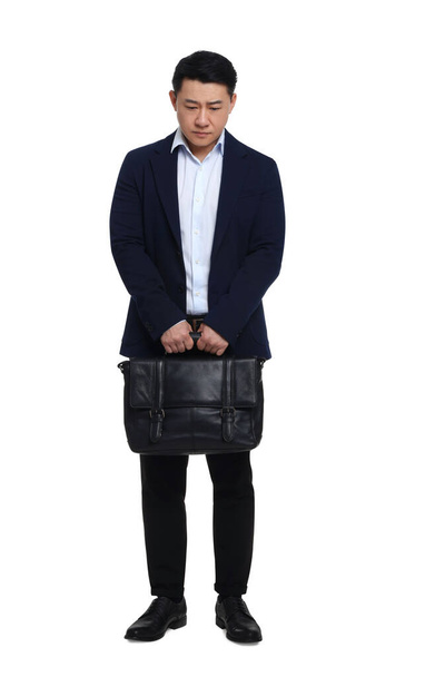 Tired businessman with briefcase posing on white background - Foto, afbeelding