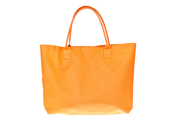Colorful orange cotton bag on white isolated background. - Photo, Image