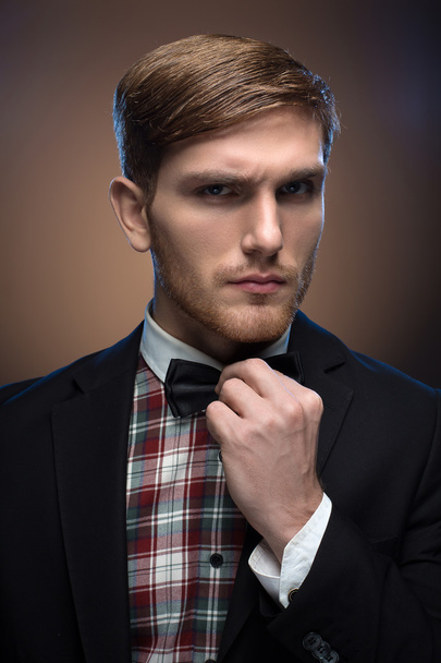 Portrait of a redheaded brutal guy with a perfectly laid haircut - Photo, Image