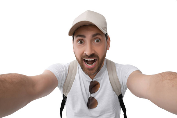 Smiling man taking selfie on white background - Foto, Imagen