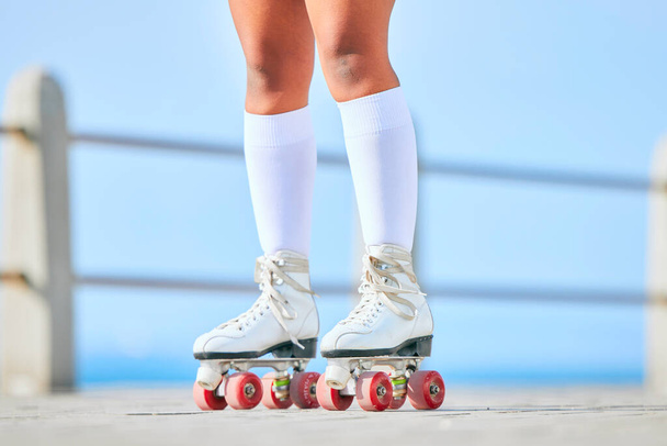 Legs, roller skates and shoes on street for exercise, workout or training outdoor. Skating, feet of person and sports on road to travel, journey and moving for freedom, hobby and fitness practice - Photo, Image