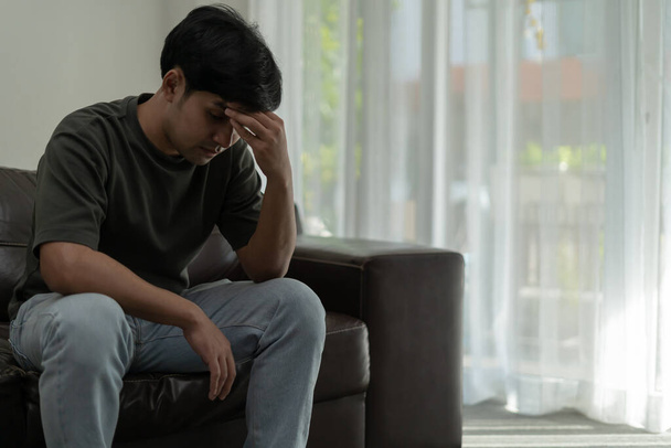Depression and mental illness. Asian man disappoint, sad after receive bad news. Stressed boy confused with unhappy problem, arguing with girlfriend, cry and worry about unexpected work, down economy. - Photo, Image