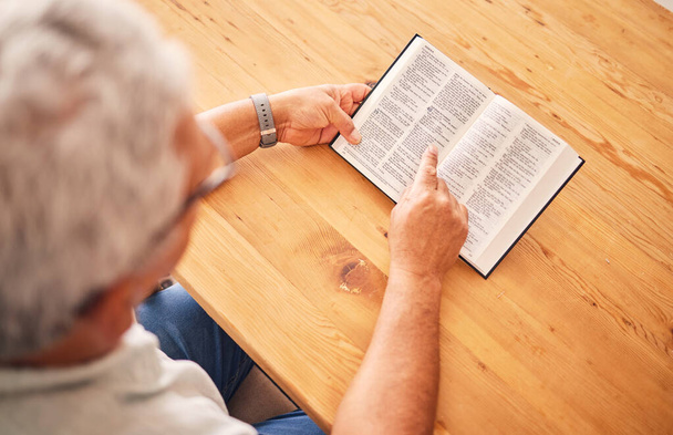 Above, reading book or old man with holy bible for worship, support or hope in Christianity faith in retirement. Jesus, God or senior person studying or learning gospel prayer in spiritual religion. - Foto, immagini