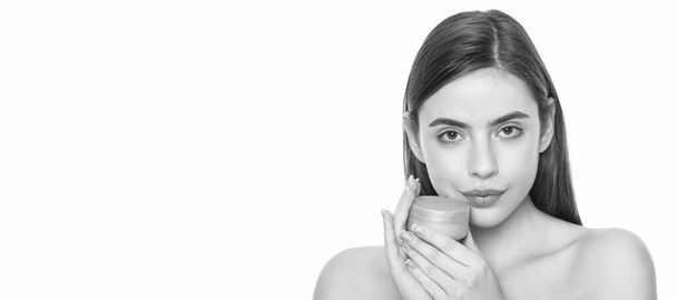 young girl hold face cream jar isolated on white background, facial treatment. Woman beauty face, close up portrait, isolated banner with copy space - Photo, Image