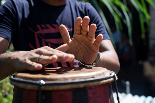 Hands of a musician playing the atabaque. Constant and perfect rhythm. Feeling of power and speed - Photo, Image