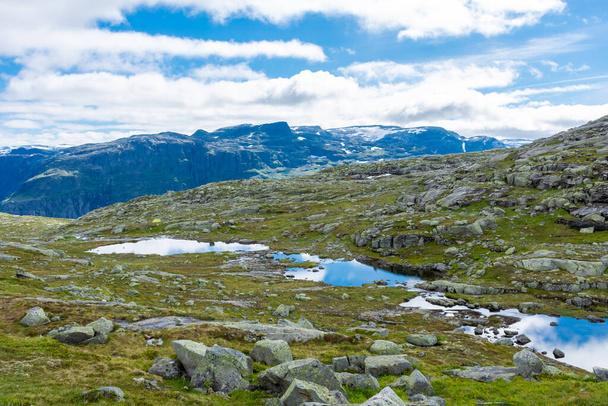 Beautiful blue ponds in the hiking trail of Trolltunga, Odda, Norway - Foto, afbeelding