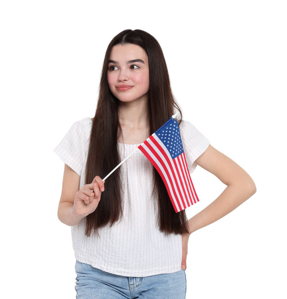 4th of July - Independence day of America. Happy teenage girl holding national flag of United States on white background - Foto, Bild