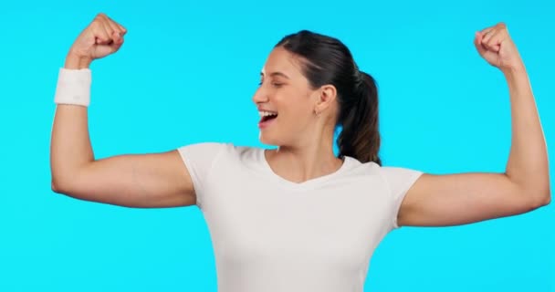 Woman, face and fitness with flex, strong arms or muscle for smile, excited or pride by blue background. Girl bodybuilder, happy and body development with comic laughing for success, exercise or goal. - Séquence, vidéo