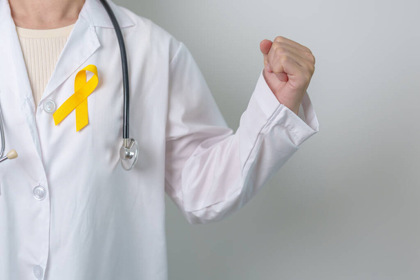 Yellow September, Suicide prevention day, Childhood, Sarcoma, bone and bladder cancer Awareness month, Yellow Ribbon for supporting people life and illness. Healthcare and World cancer day concept - Фото, изображение