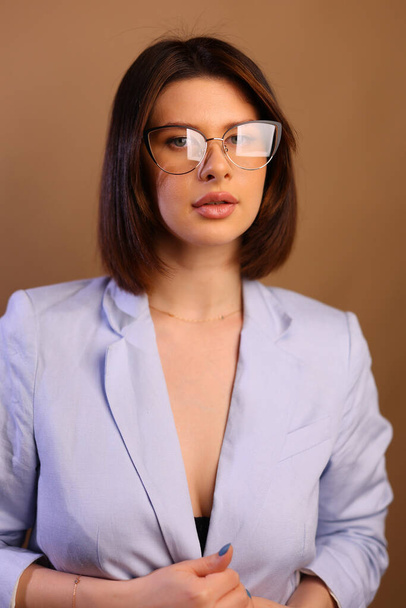 Smiling smart attractive young black lady in glasses standing in lobby and looking at camera, she working in prosperous company. High quality photo - Zdjęcie, obraz
